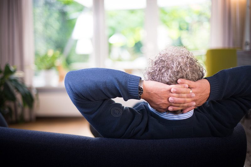 a senior sitting on the sofa