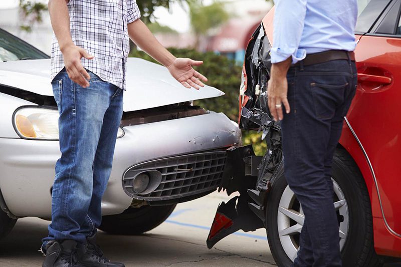 two people involved in a car crash talking