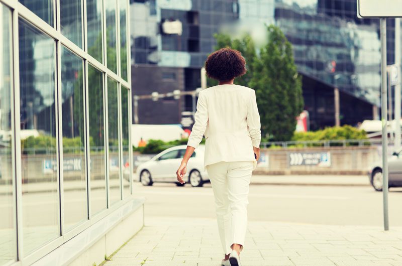 a woman walking down the street